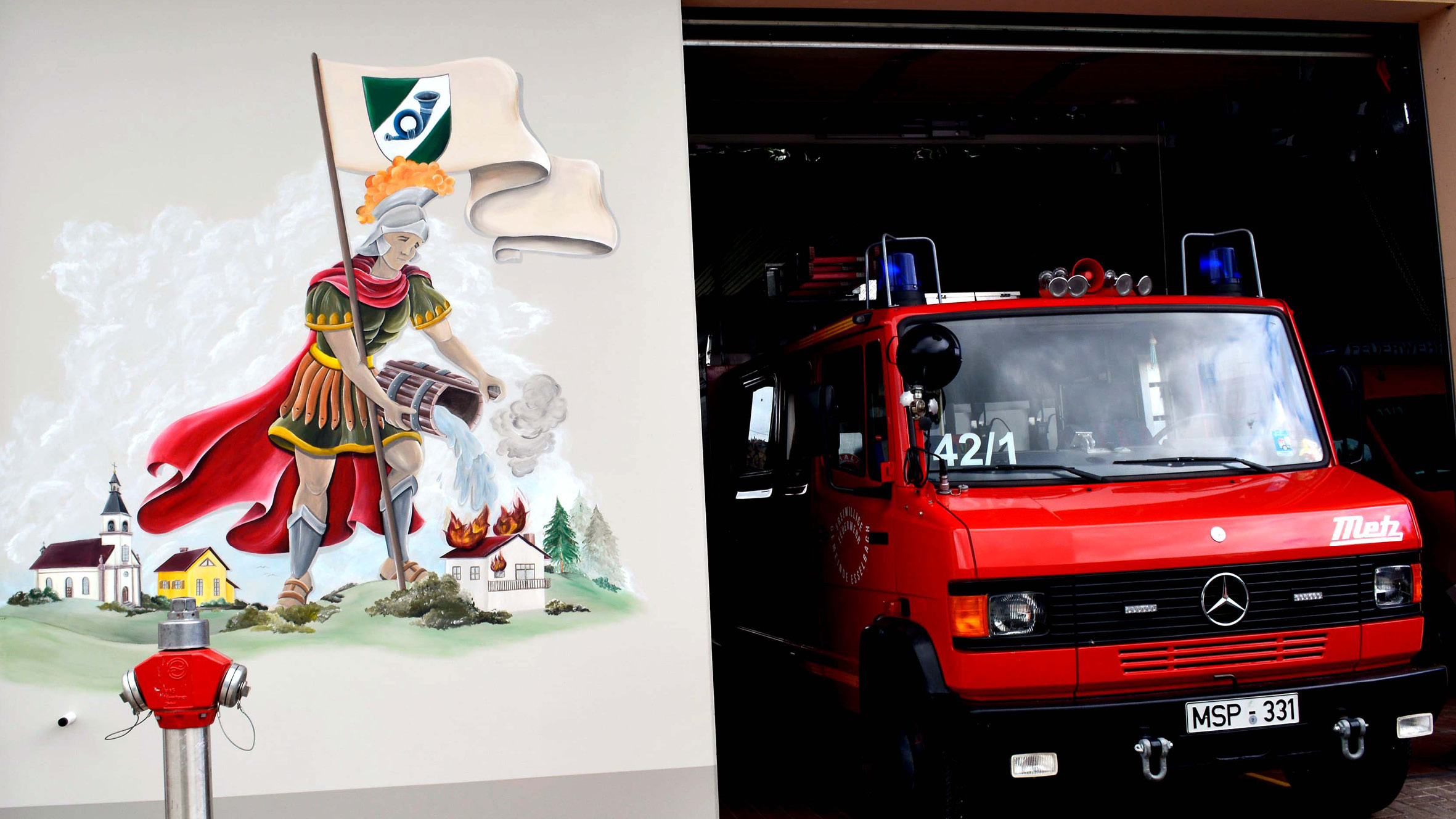 Sina-Cyliax_Wandbemalung_Feuerwehrhaus-Esselbach-Heiliger-Sankt-Florian-Slider